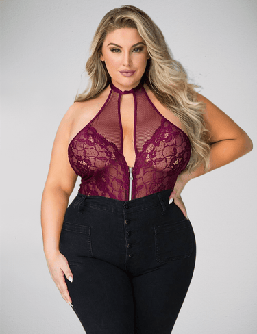 a woman wearing a purple top and black pants